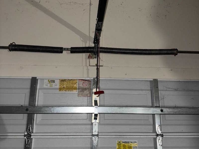 Spring shaft and center support above a sectional door